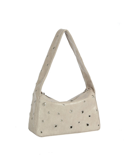 Beige handbag with studded details on a white background