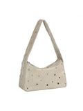 Beige handbag with studded details on a white background
