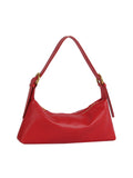 Red handbag with a shoulder strap on a white background