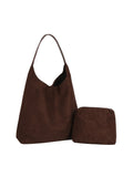Brown handbag with matching pouch on a white background