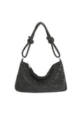 Black beaded handbag with knotted handle on a white background
