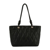 Quilted shopper tote with knot detailed handle